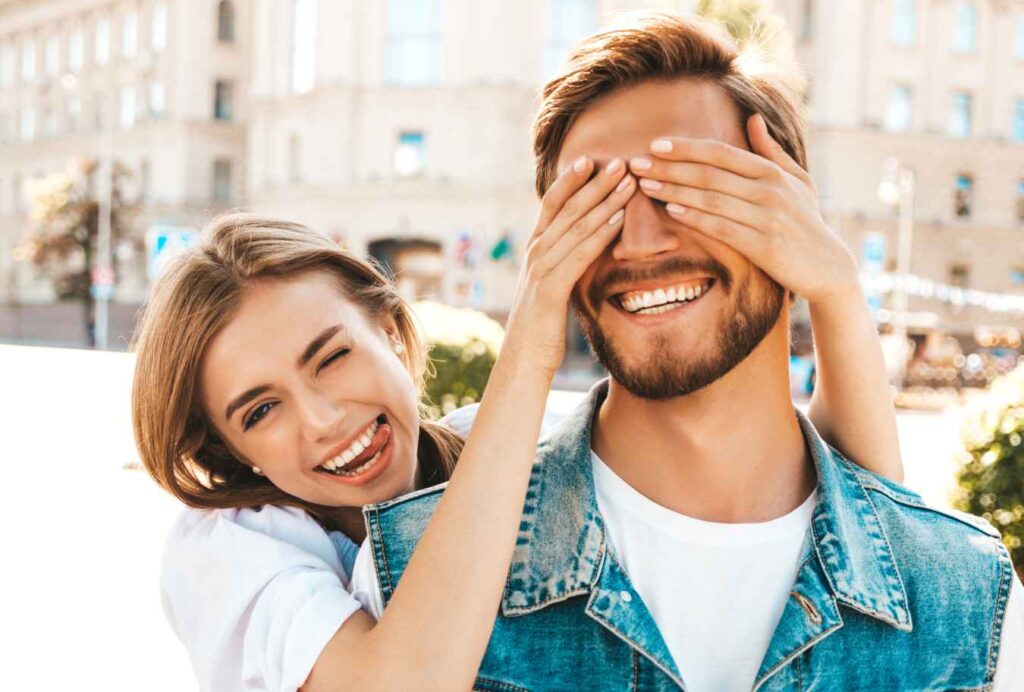 smiling outside with couple